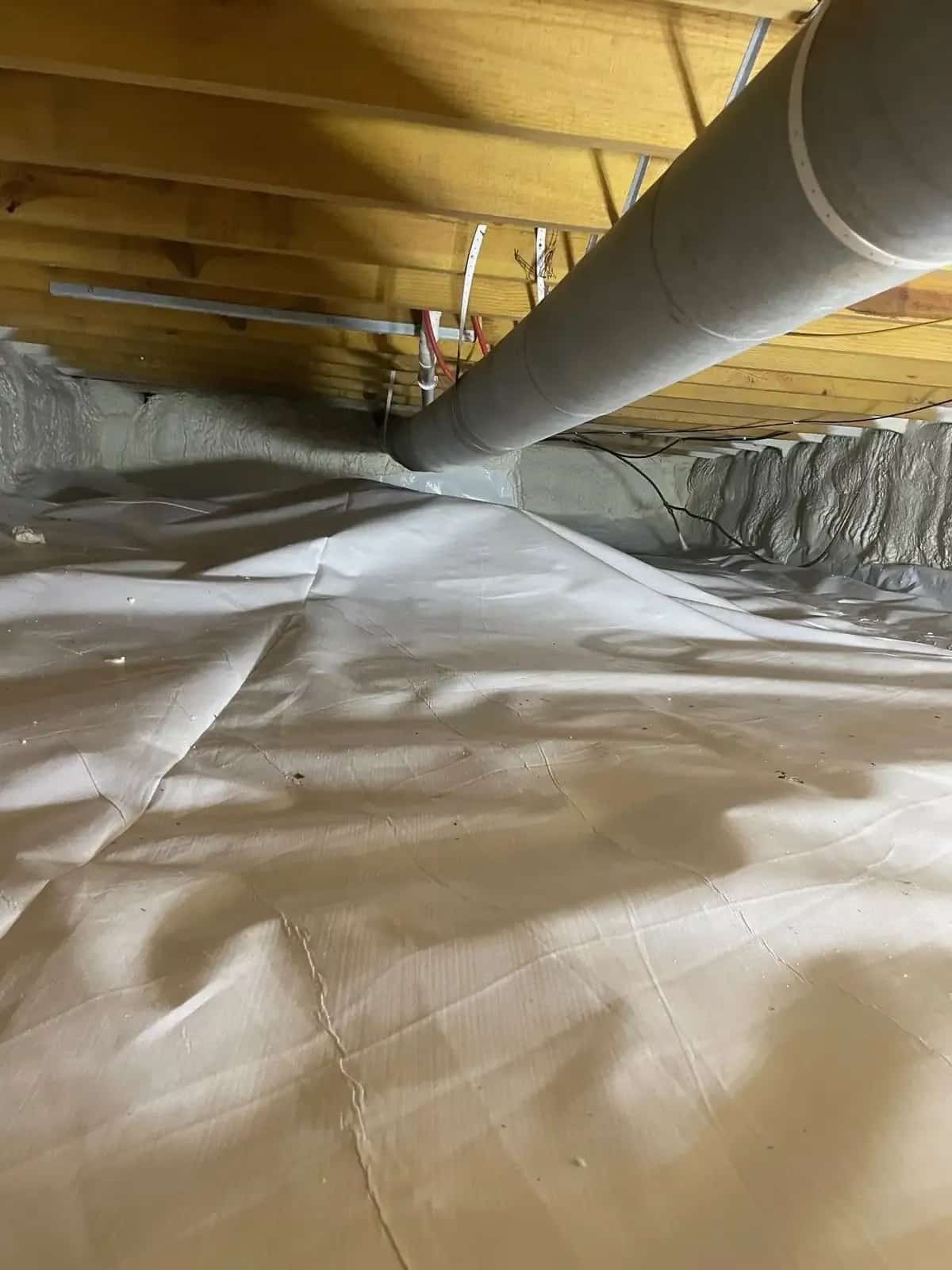 Spray foam insulation filling framed wall cavities in Indiana