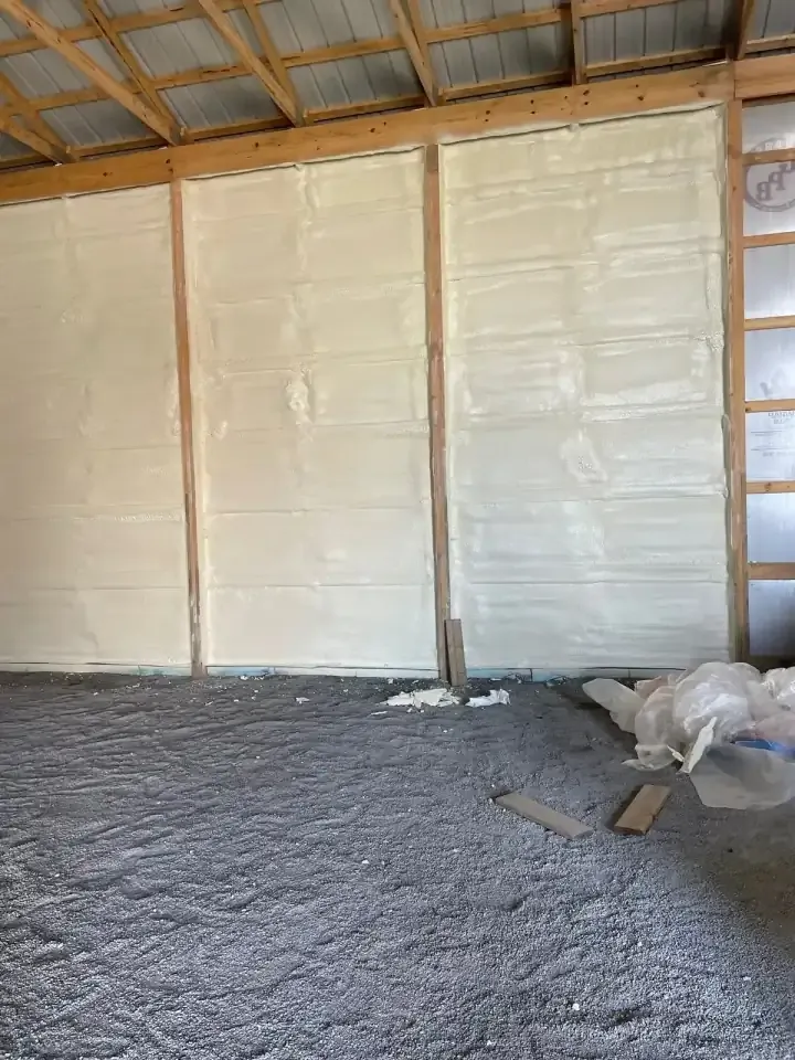 Spray foam insulation applied between wall studs in central Indiana